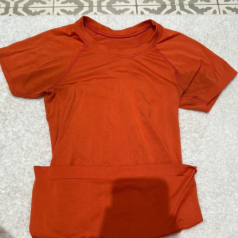 Orange Lululemon Tank the color Brick